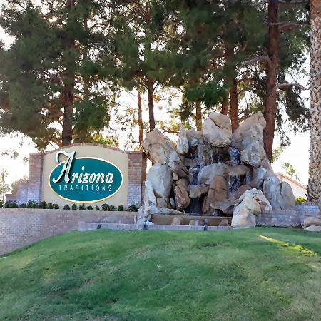 Photo of Arizona Traditions entrance sign and water feature