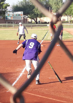 Photo of seniors playing softball